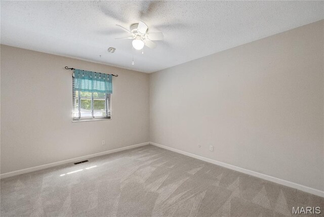 2417 Charente Dr, Maryland Heights, MO 63043 - empty room with ceiling fan, carpet, and a textured ceiling