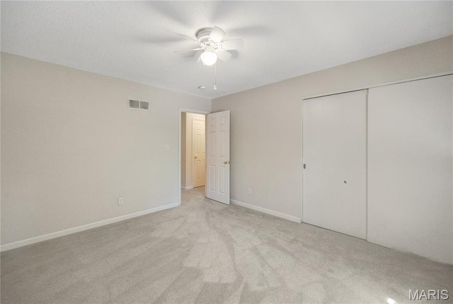 2417 Charente Dr, Maryland Heights, MO 63043 - unfurnished bedroom with light carpet, a closet, and ceiling fan