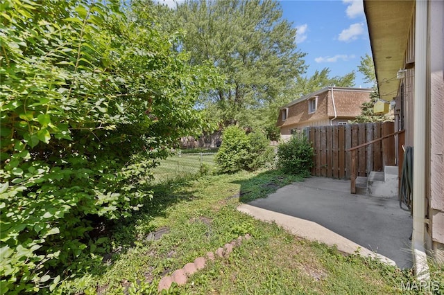 2417 Charente Dr, Maryland Heights, MO 63043 - fenced backyard with a patio