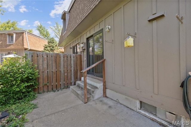 2417 Charente Dr, Maryland Heights, MO 63043 - property entrance with board and batten siding