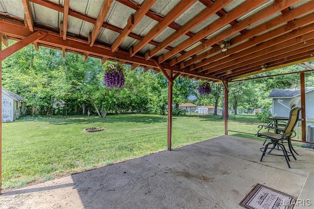 511 N Acre Dr, Richland, MO 65556 - view of patio featuring a storage shed