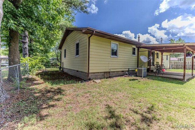 511 N Acre Dr, Richland, MO 65556 - back of house with a fenced backyard and a patio
