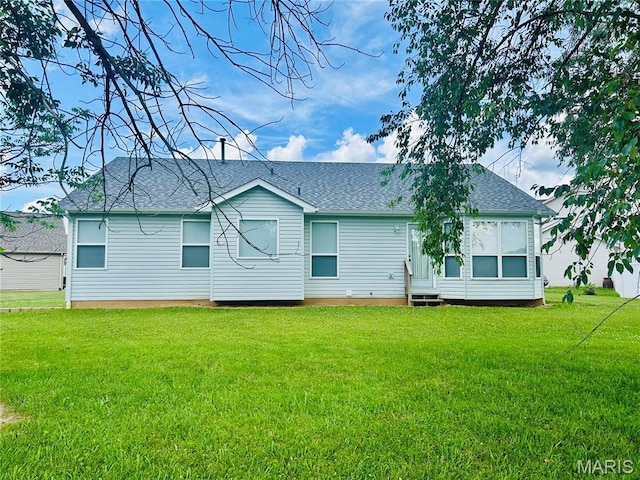 2401 Mountain Range Ct, Pacific, MO 63069 - rear view of house featuring a yard, entry steps, and roof with shingles