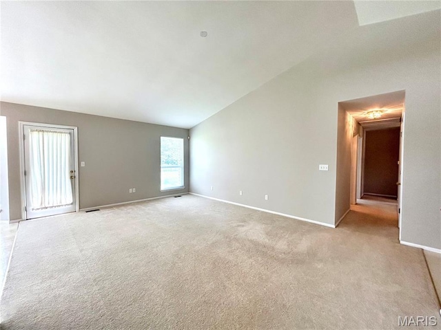 2401 Mountain Range Ct, Pacific, MO 63069 - spare room featuring lofted ceiling and light carpet