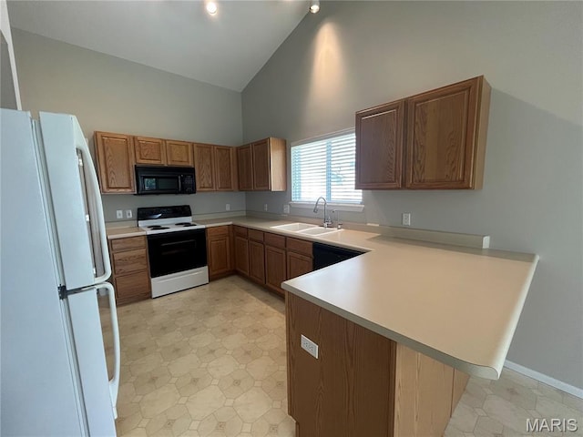2401 Mountain Range Ct, Pacific, MO 63069 - kitchen featuring white appliances, high vaulted ceiling, a peninsula, light countertops, and brown cabinets