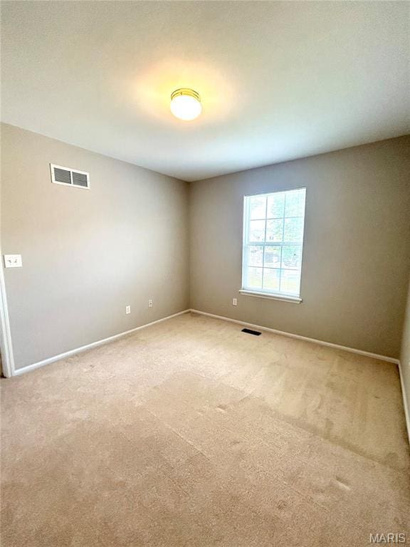 2401 Mountain Range Ct, Pacific, MO 63069 - unfurnished room with baseboards and light colored carpet