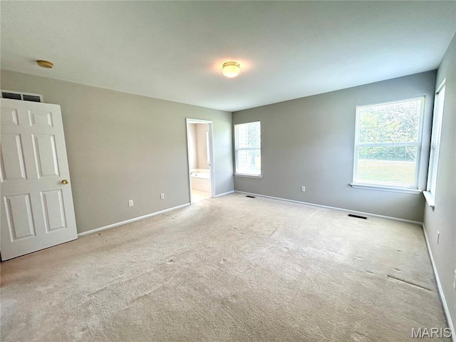 2401 Mountain Range Ct, Pacific, MO 63069 - unfurnished bedroom with multiple windows, carpet, and ensuite bath