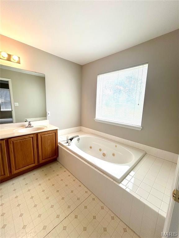 2401 Mountain Range Ct, Pacific, MO 63069 - full bathroom with a whirlpool tub and vanity