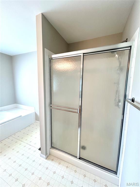 2401 Mountain Range Ct, Pacific, MO 63069 - full bath featuring a stall shower, tile patterned floors, and a garden tub