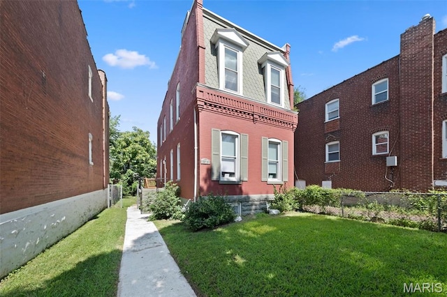 3615 Nebraska Ave, Saint Louis, MO 63118 - view of property exterior with mansard roof and brick siding
