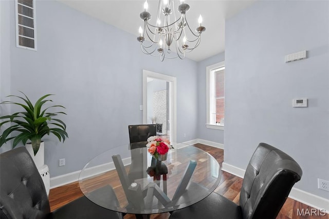 3615 Nebraska Ave, Saint Louis, MO 63118 - dining space featuring a chandelier and wood finished floors