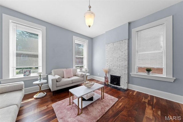 3615 Nebraska Ave, Saint Louis, MO 63118 - living area featuring plenty of natural light and dark wood-style floors