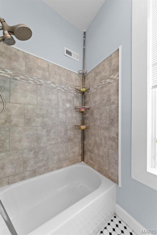 3615 Nebraska Ave, Saint Louis, MO 63118 - bathroom featuring shower / washtub combination and tile patterned floors