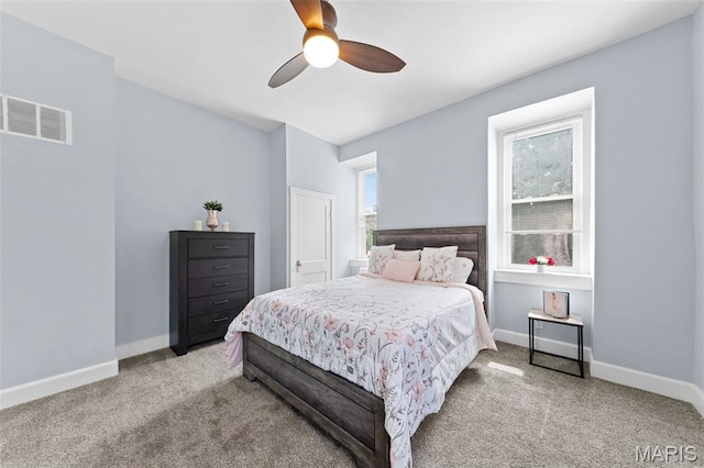 3615 Nebraska Ave, Saint Louis, MO 63118 - carpeted bedroom featuring multiple windows and a ceiling fan