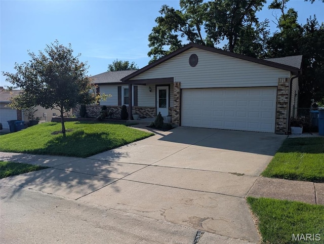 12123 Josephine Marie Dr, Maryland Heights, MO 63043 - ranch-style house with a front lawn, an attached garage, and driveway
