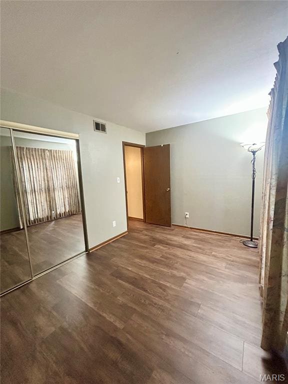 4278 Kay Ln Unit 2, Saint Louis, MO 63123 - unfurnished bedroom with wood finished floors and baseboards