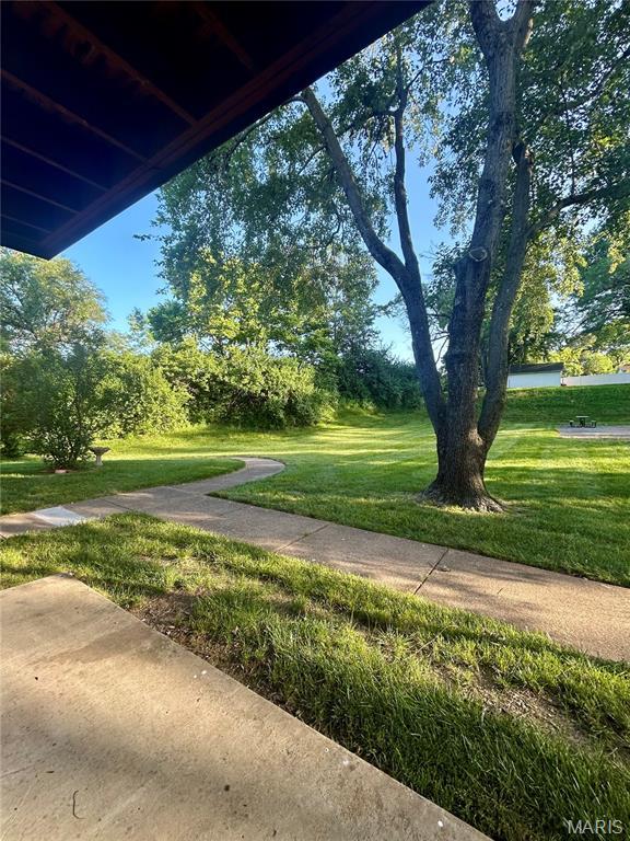 4278 Kay Ln Unit 2, Saint Louis, MO 63123 - view of grassy yard featuring view of wooded area