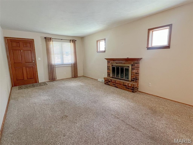 138 S 33rd St, Belleville, IL 62226 - unfurnished living room featuring a brick fireplace and carpet flooring