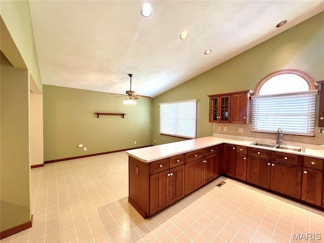 138 S 33rd St, Belleville, IL 62226 - kitchen with a peninsula, healthy amount of natural light, light countertops, lofted ceiling, and a ceiling fan