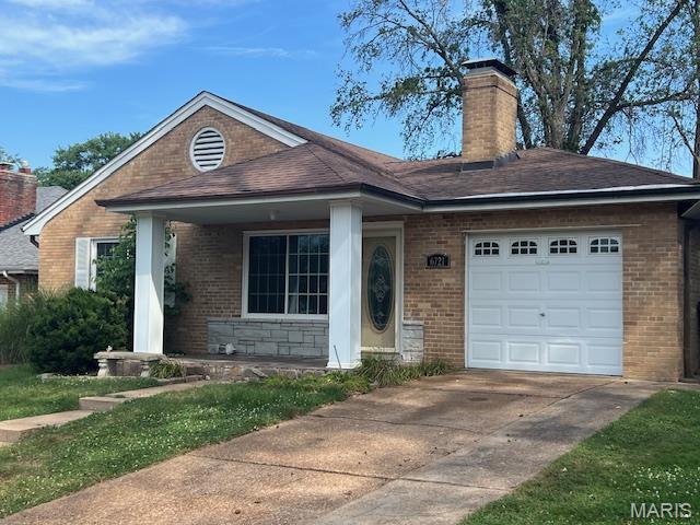 6721 Itaska St, Saint Louis, MO 63109 - single story home featuring driveway, a garage, a chimney, and brick siding