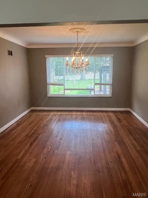 6721 Itaska St, Saint Louis, MO 63109 - spare room with healthy amount of natural light, a chandelier, dark wood-type flooring, and ornamental molding