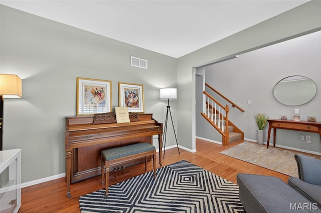 2426 Guardian Ct, Arnold, MO 63010 - sitting room with wood finished floors and stairs