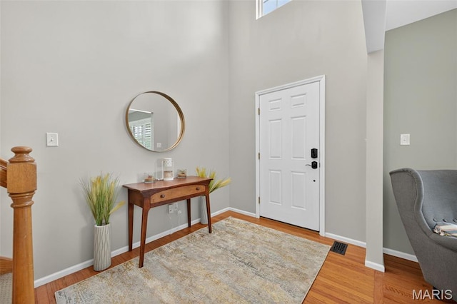 2426 Guardian Ct, Arnold, MO 63010 - foyer featuring wood finished floors and a high ceiling