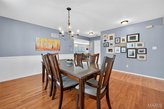 2426 Guardian Ct, Arnold, MO 63010 - dining room with light wood finished floors and a chandelier