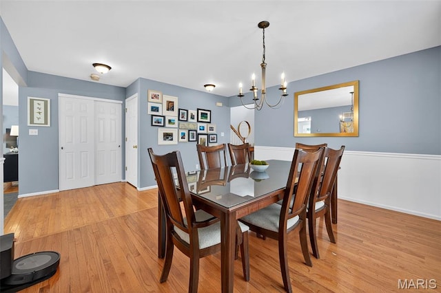 2426 Guardian Ct, Arnold, MO 63010 - dining room with light wood-type flooring and a chandelier