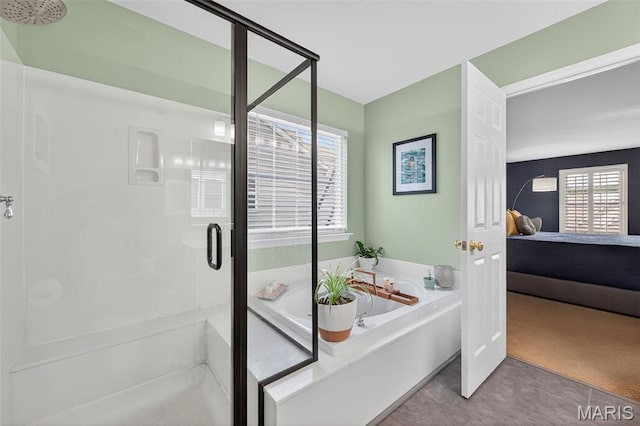 2426 Guardian Ct, Arnold, MO 63010 - bathroom with ensuite bathroom, a stall shower, and a garden tub