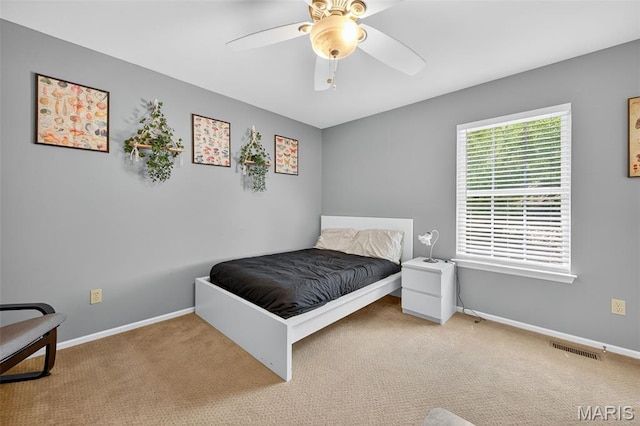 2426 Guardian Ct, Arnold, MO 63010 - carpeted bedroom with baseboards and ceiling fan