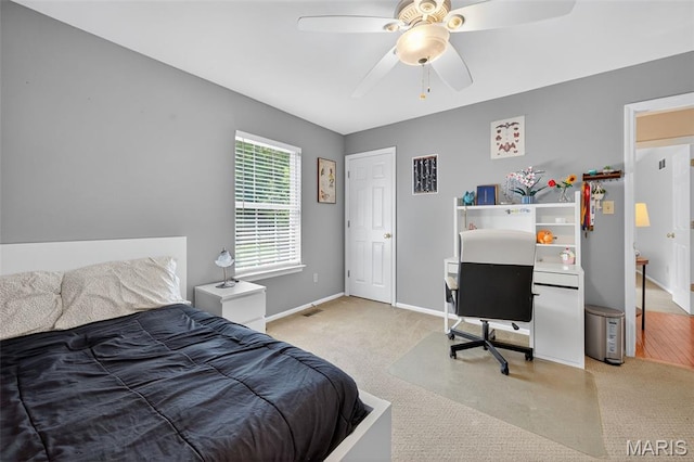 2426 Guardian Ct, Arnold, MO 63010 - bedroom with light carpet, a desk, and ceiling fan