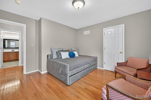 2426 Guardian Ct, Arnold, MO 63010 - bedroom featuring light wood-style floors and baseboards