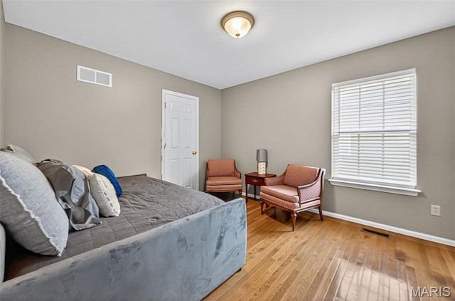 2426 Guardian Ct, Arnold, MO 63010 - bedroom featuring baseboards and light wood finished floors