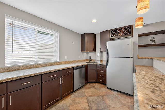 2426 Guardian Ct, Arnold, MO 63010 - kitchen with freestanding refrigerator, dishwasher, dark brown cabinetry, light countertops, and recessed lighting