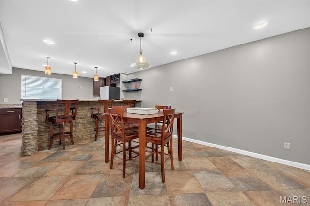 2426 Guardian Ct, Arnold, MO 63010 - dining room featuring a community bar, stone tile flooring, and recessed lighting