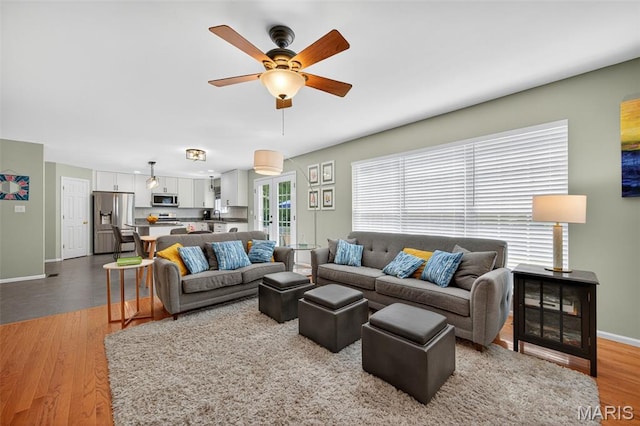 2426 Guardian Ct, Arnold, MO 63010 - living area with ceiling fan and wood finished floors
