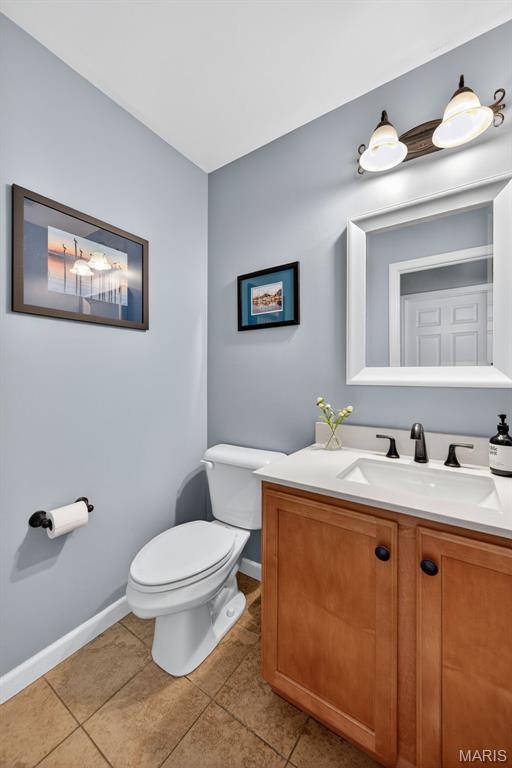 2426 Guardian Ct, Arnold, MO 63010 - half bath with vanity and tile patterned floors