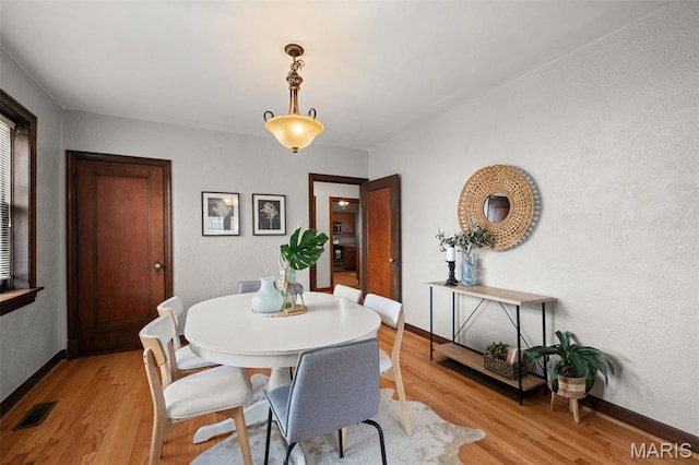 4932 Fairview Ave, Saint Louis, MO 63139 - dining room with light wood-style floors and baseboards