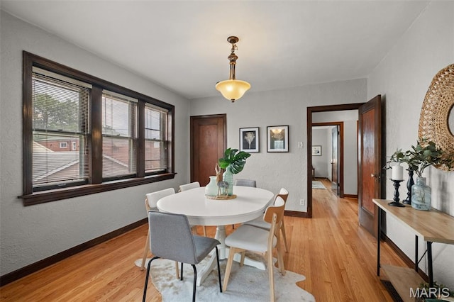 4932 Fairview Ave, Saint Louis, MO 63139 - dining area with light wood-type flooring and a textured wall