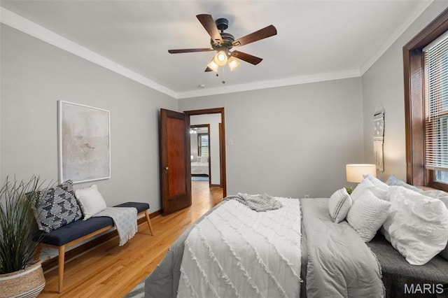 4932 Fairview Ave, Saint Louis, MO 63139 - bedroom with multiple windows, light wood-type flooring, ornamental molding, and a ceiling fan