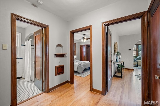 4932 Fairview Ave, Saint Louis, MO 63139 - corridor with arched walkways and light wood finished floors