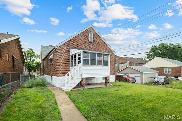 4932 Fairview Ave, Saint Louis, MO 63139 - back of house featuring a fenced backyard and brick siding