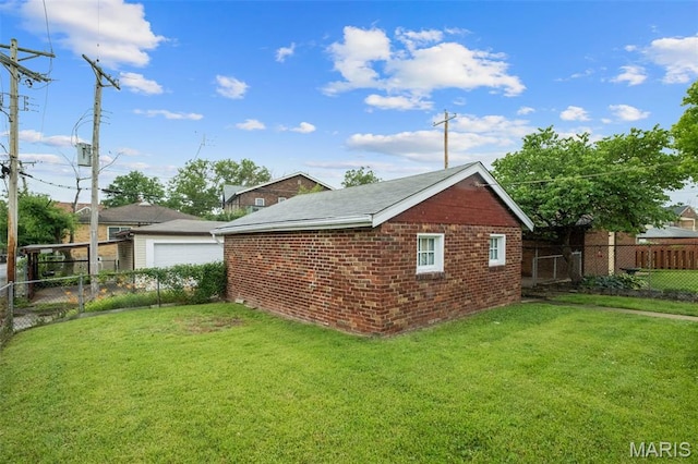 4932 Fairview Ave, Saint Louis, MO 63139 - view of side of property with a fenced backyard, a detached garage, brick siding, and an outdoor structure