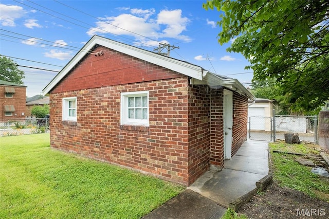 4932 Fairview Ave, Saint Louis, MO 63139 - view of property exterior featuring brick siding and a gate