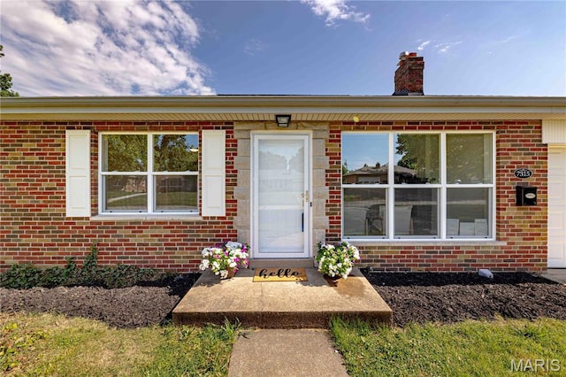 7315 Cheshire Ln, Affton, MO 63123 - view of front of house featuring brick siding and a chimney
