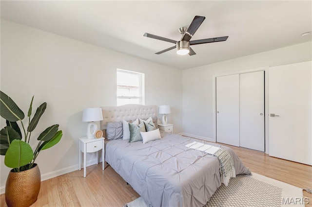 7315 Cheshire Ln, Affton, MO 63123 - bedroom with wood finished floors, ceiling fan, and a closet