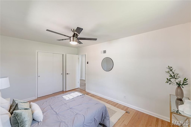 7315 Cheshire Ln, Affton, MO 63123 - bedroom featuring light wood-style flooring, a closet, and ceiling fan