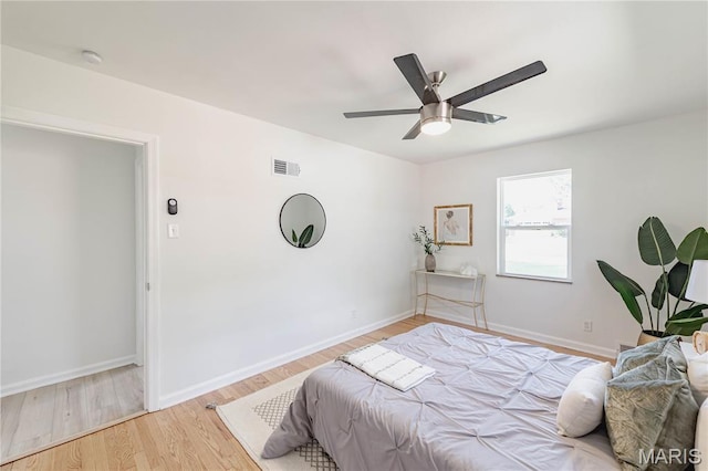 7315 Cheshire Ln, Affton, MO 63123 - bedroom with light wood finished floors and a ceiling fan