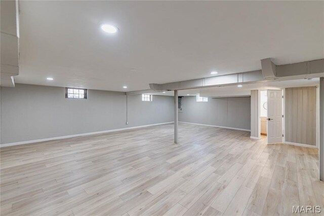 7315 Cheshire Ln, Affton, MO 63123 - below grade area featuring light wood-style floors, recessed lighting, and healthy amount of natural light